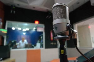 photo of a microphone in a recording studio